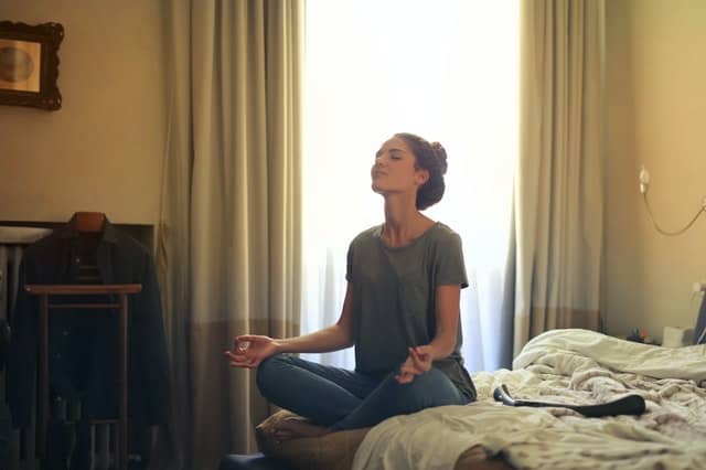 woman-meditating-in-bedroom-3772612