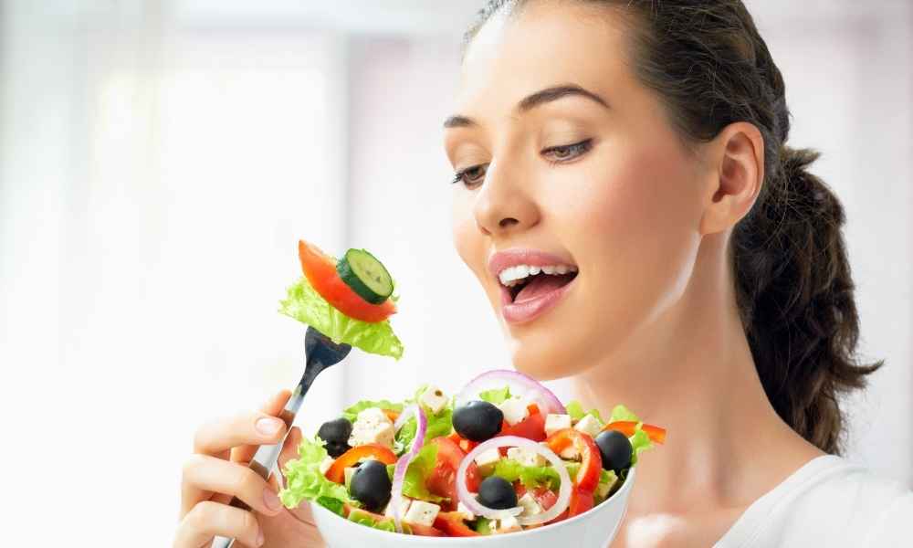 Woman eating salad